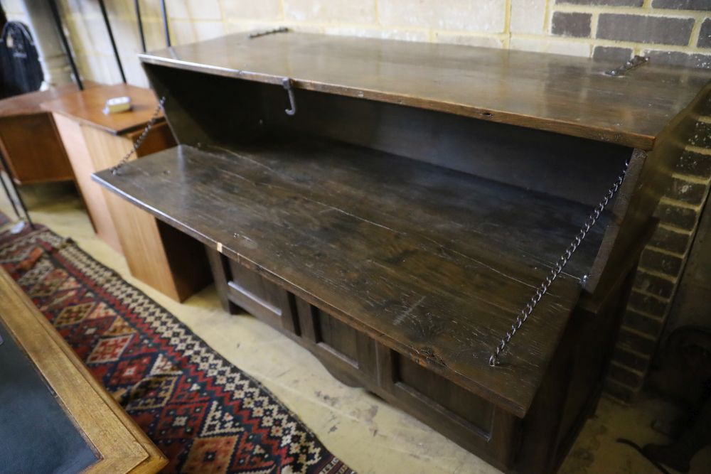 A French elm dough bin on cabinet base fitted two doors and a small central drawer, width 162cm, depth 51cm, height 112cm